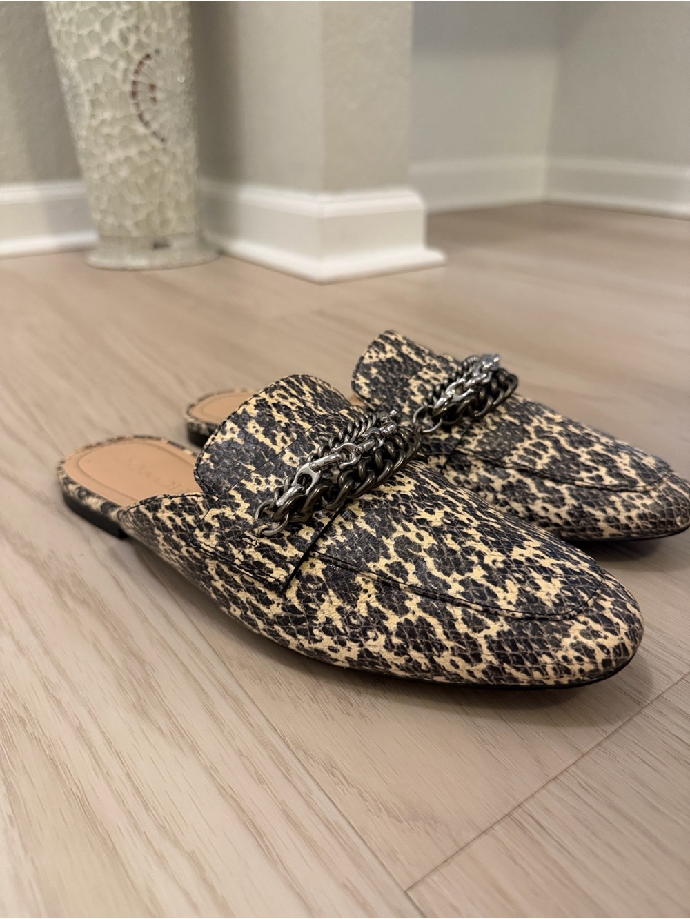 Coach Leopard-Print Chain-Trim Mules in Black and Cream